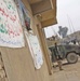 An Iraqi policeman stands guard near a perimeter