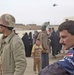 An Iraqi policeman and an Iraqi Army soldier stand guard