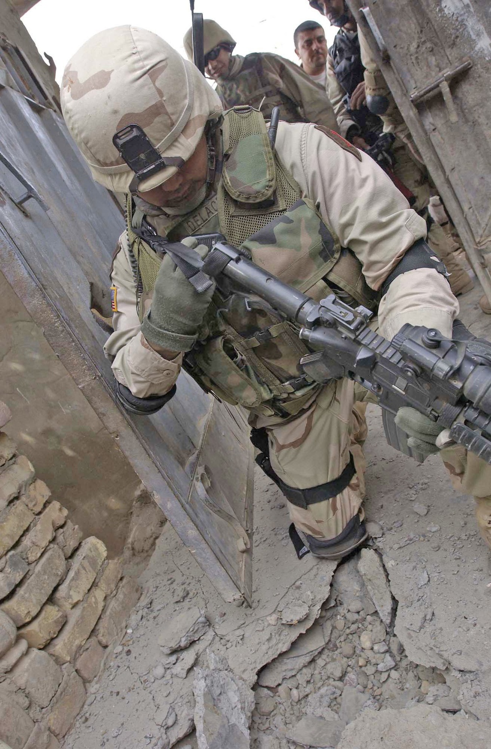 Capt. Henry Delacruz tries to dig up a mortar round