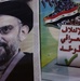 A poster encouraging Iraqis to vote hangs on a wall