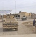 A U.S. Army convoy rolls through the city of Balad
