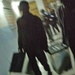 Iraqi polling center workers carry out boxes of ballots