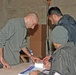 Iraqi citizens check-in to receive their ballots