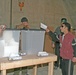 Iraqi citizens cast their votes at the Al Asad polling station