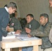 Iraqi citizens check-in to receive their ballots