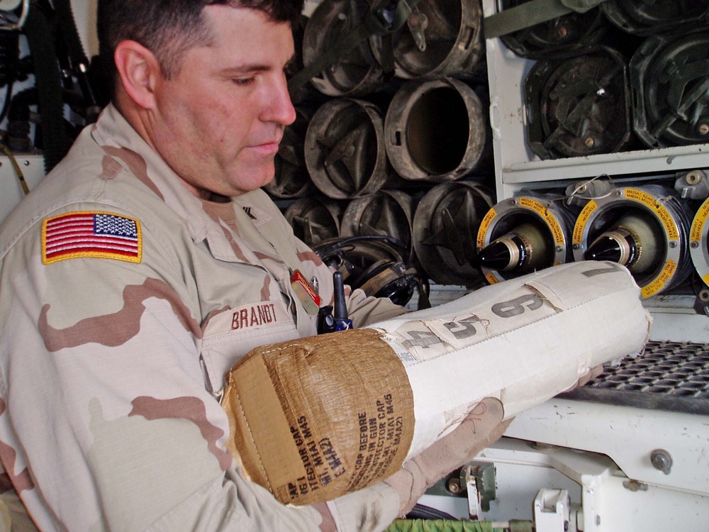Sgt. Cory Brandt prepares a charge to be loaded