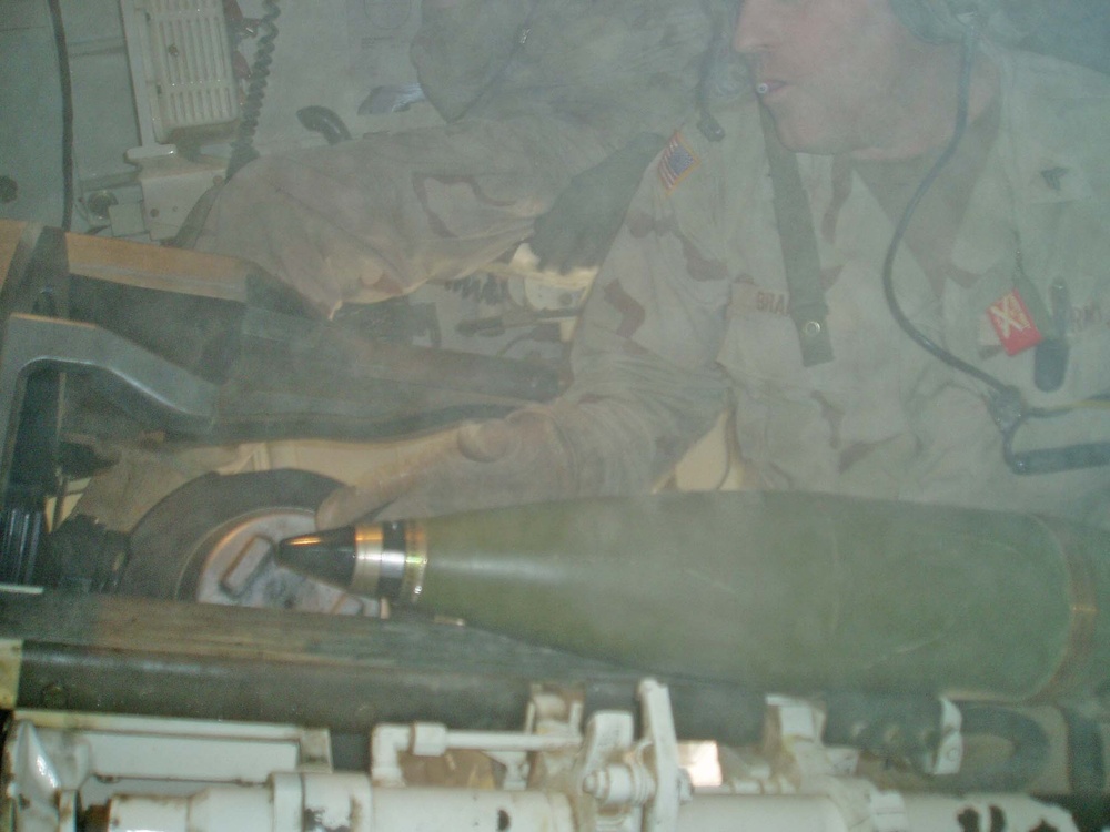 Sgt. Cory Brandt quickly inserts another round seconds after