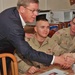 Senator Johnny Isaacson shaking hands with soldiers