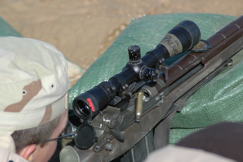 A round ejects as one of the students finds his target