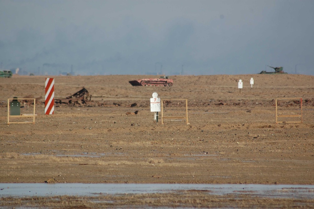 Soldiers take aim at targets staked in ground