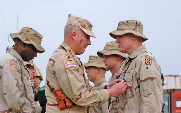 Lt. Gen. Vines Presents Pfc. Bild With a Purple Heart