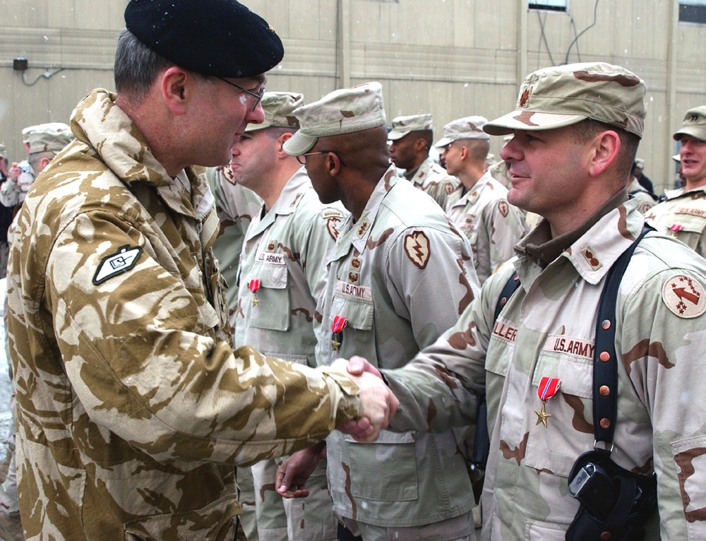 British Maj. Gen. Gilchrist Congratulates Maj. Miiller