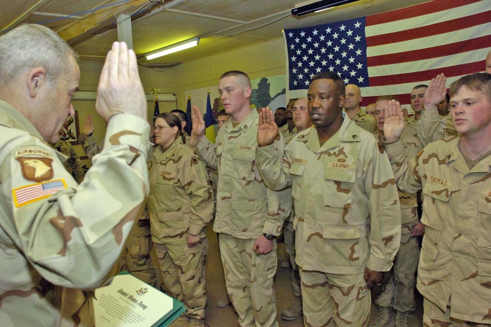 Lt. Gen. James R. Helmly dministers an oath of enlistment