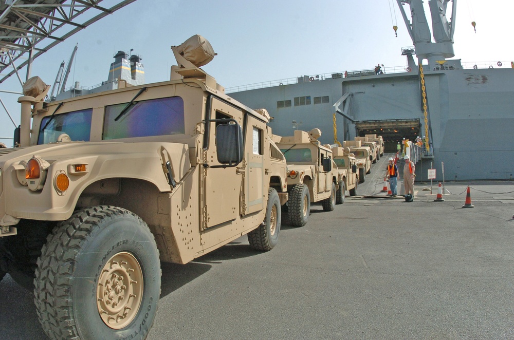 New Level-1 armored Humvees roll off the USNS Altair