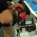 Alfredo Francisco sets a machine to make a copy of a key