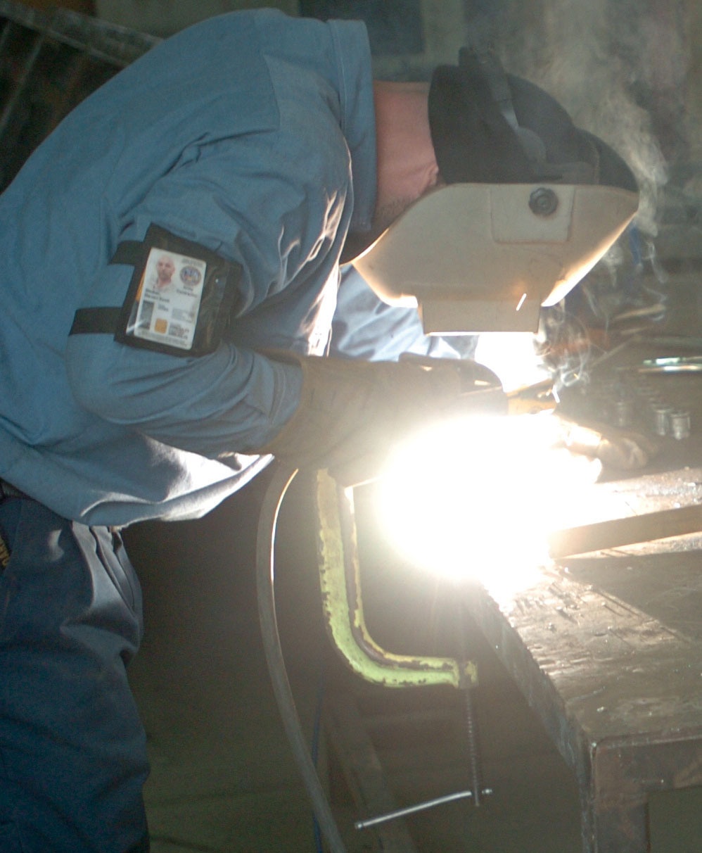 Steven Stobier fabricates pipe to prepare it for DPW plumbers