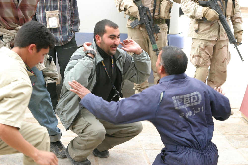 Iraqi citizens celebrate by dancing and chanting