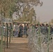 Iraqi civilians line up to vote