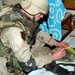 Spc. Patton labels a bag filled with AK-47 magazines