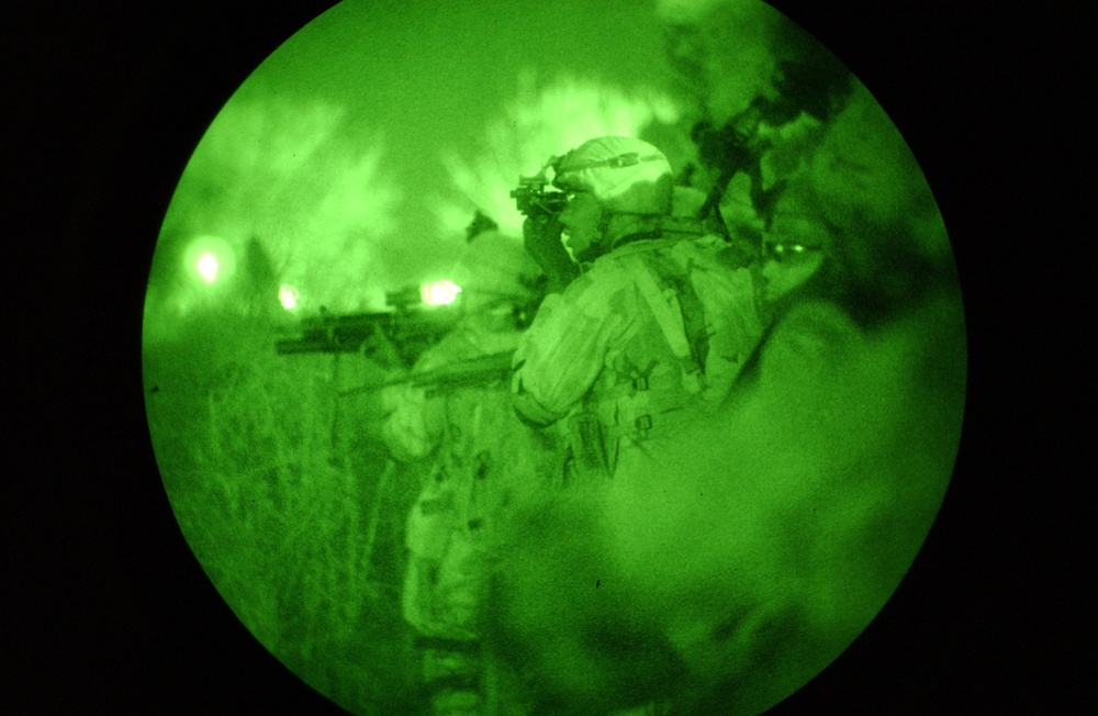 Staff Sgt. Davis adjusts his night vision goggles