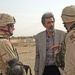 Lt. Col. Logan listens as his interepretor explains
