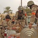 Members of the Iraqi National Guard serve lunch