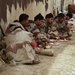 Members of the Iraqi National Guard eat in shifts
