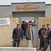 Iraqi policemen guard a polling station in a village