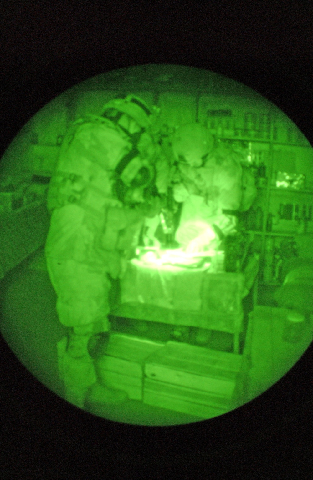 Soldiers search a shed in the city of As Siniyah, Iraq