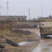 A U.S Army HUMVEE passes through an Iraqi village