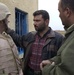 Lt Col Ronald Kirby discuss water issues with local Iraqis