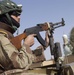 An Iraqi Army soldier mans a gun-truck