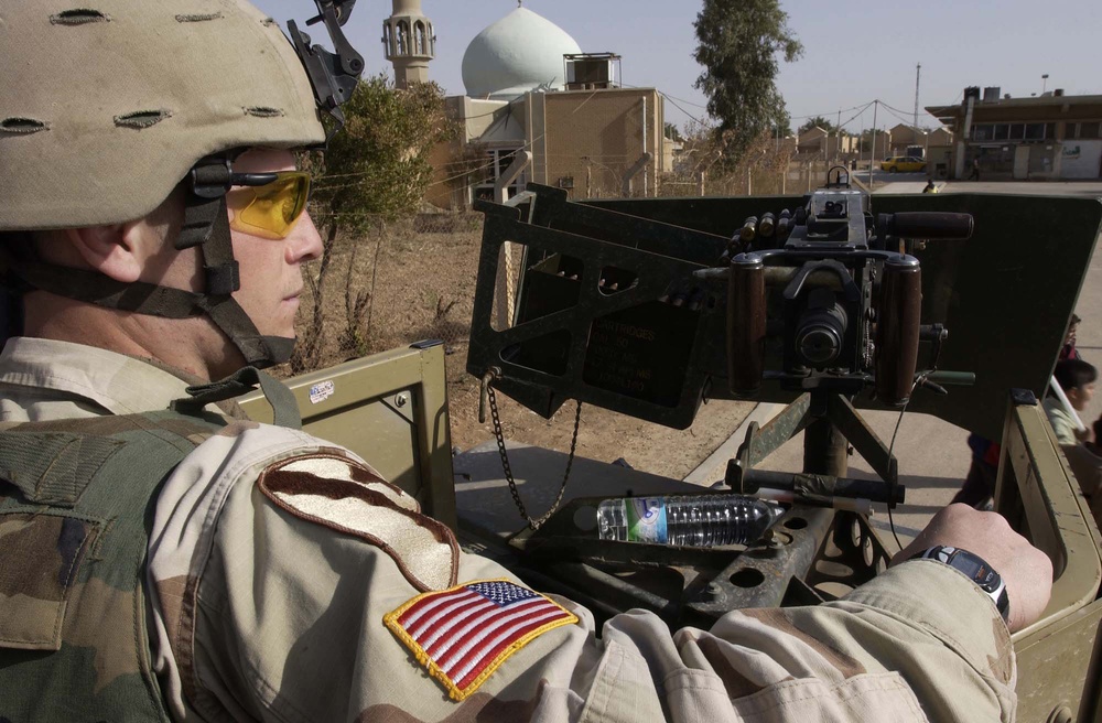 Spc. Benjamin Swain mans a 50-caliber machine gun