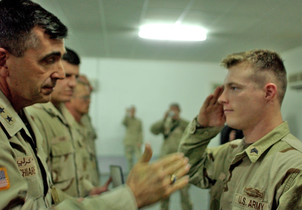 Sgt. Mathew Zedwick salutes Maj. Gen. Peter Chiarelli