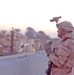 Pfc. Allen scans the Baghdad skyline for possible attacks