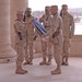 Lt. Col. Raymond Lacey rolls his units guidon