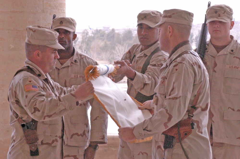 Lt. Col. Raymond Lacey rolls his units guidon