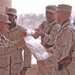 Lt. Col. Raymond Lacey rolls his units guidon