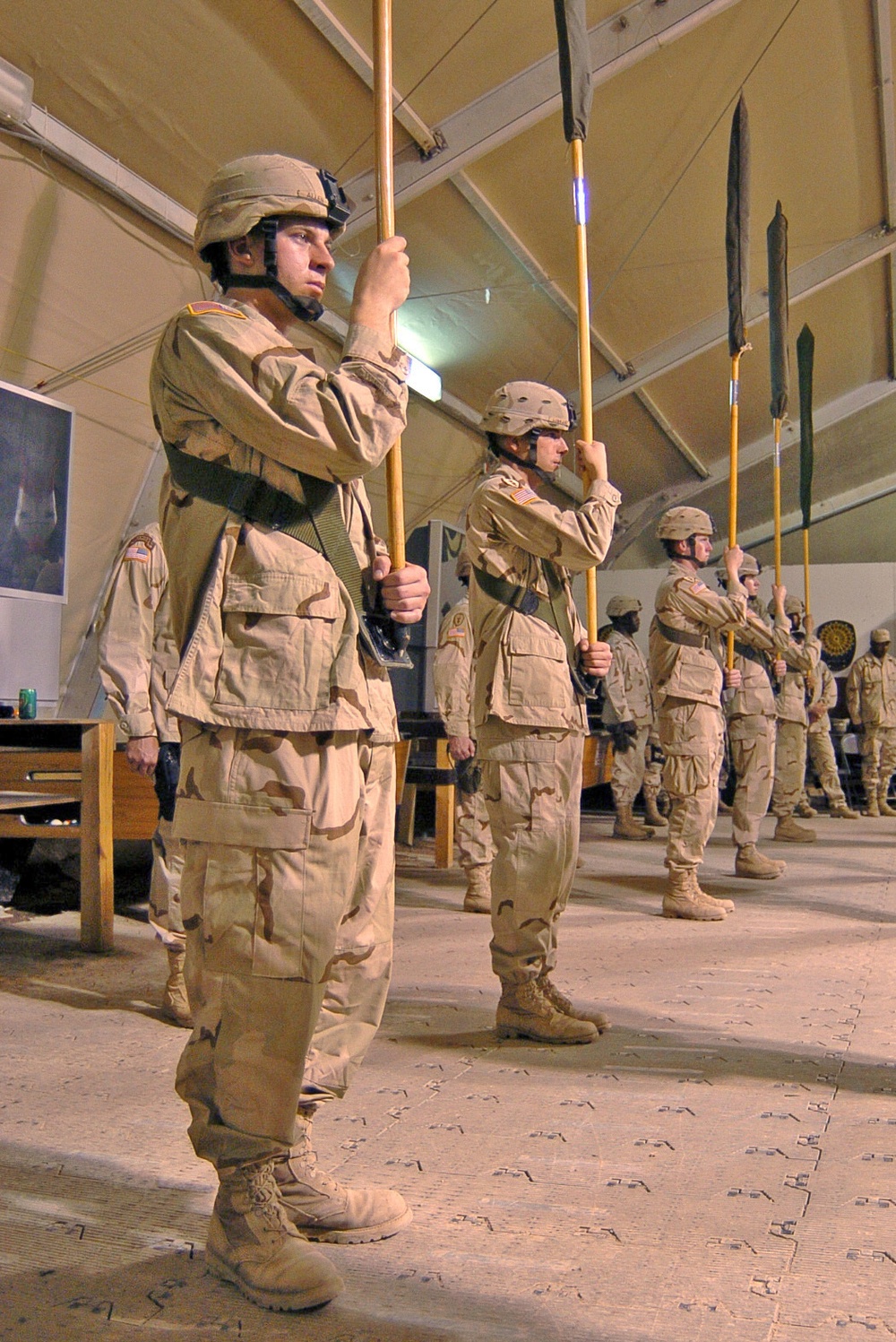 Soldiers hold the cased colors during the TOA ceremony