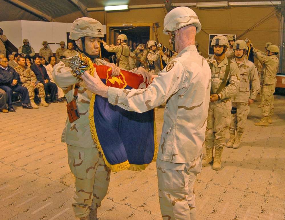 Col. Miles and Sgt. Maj.Taylor case the colors