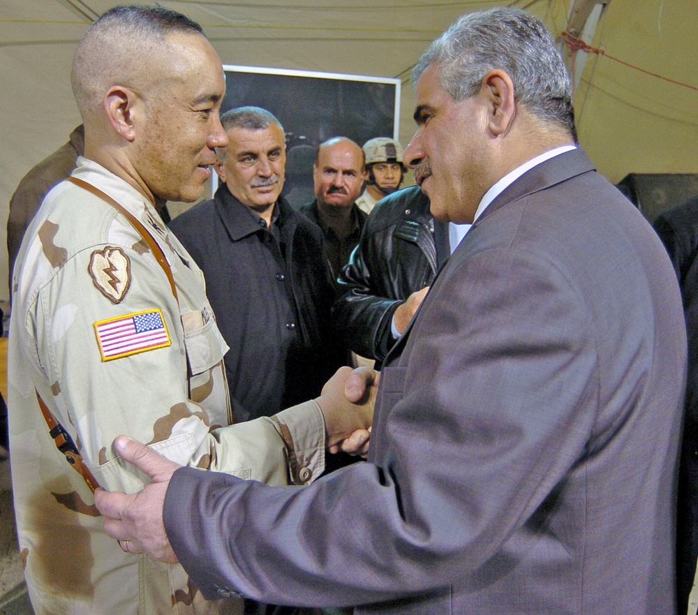 Col. Lloyd Miles receives a final farewell from Kirkuk Gov.