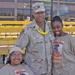 Capt. Reginald Bryant stands with his wife and daughter