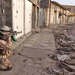 A Soldier takes aim at a vehicle attempting to enter