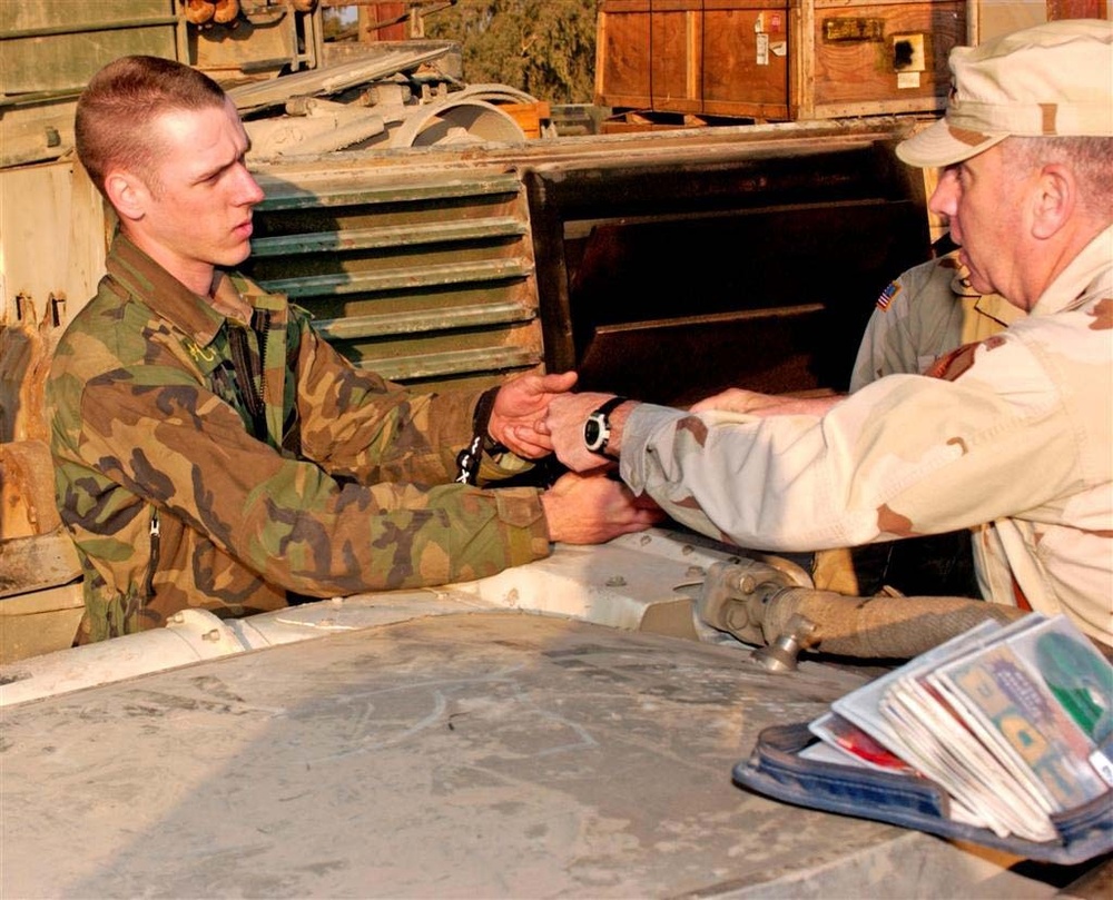 Sgt. James Chamlee receives a coin for his hard work