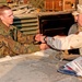 Sgt. James Chamlee receives a coin for his hard work