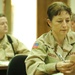 CWO Adcock studies phrases out of her Arabic book