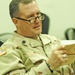 Lt. Col. David R. Brock reads phrases out his Arabic book