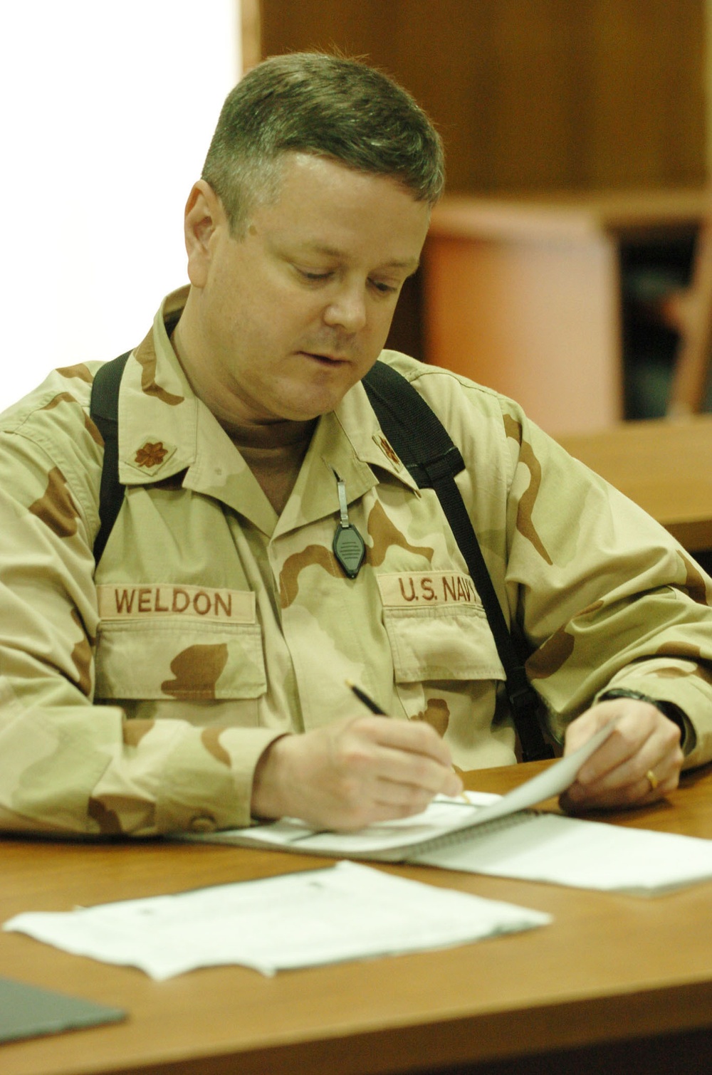 Lt. Cmdr. Steve Weldon studies pronunciation notes