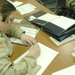 1st Lt. Holland takes notes during an Arabic language class