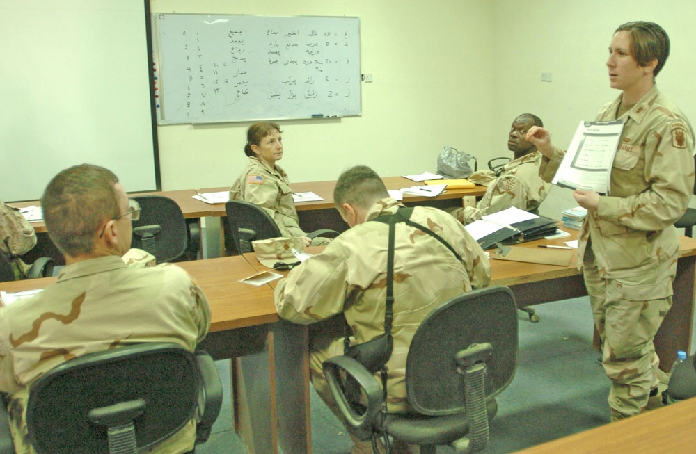 1st Lt. Debbie Holland explains some homework
